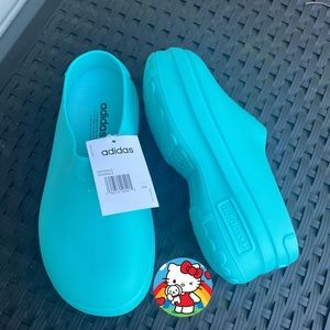 Adidas clogs/Never worn. Size 41 (7.5 men/9.5 women)